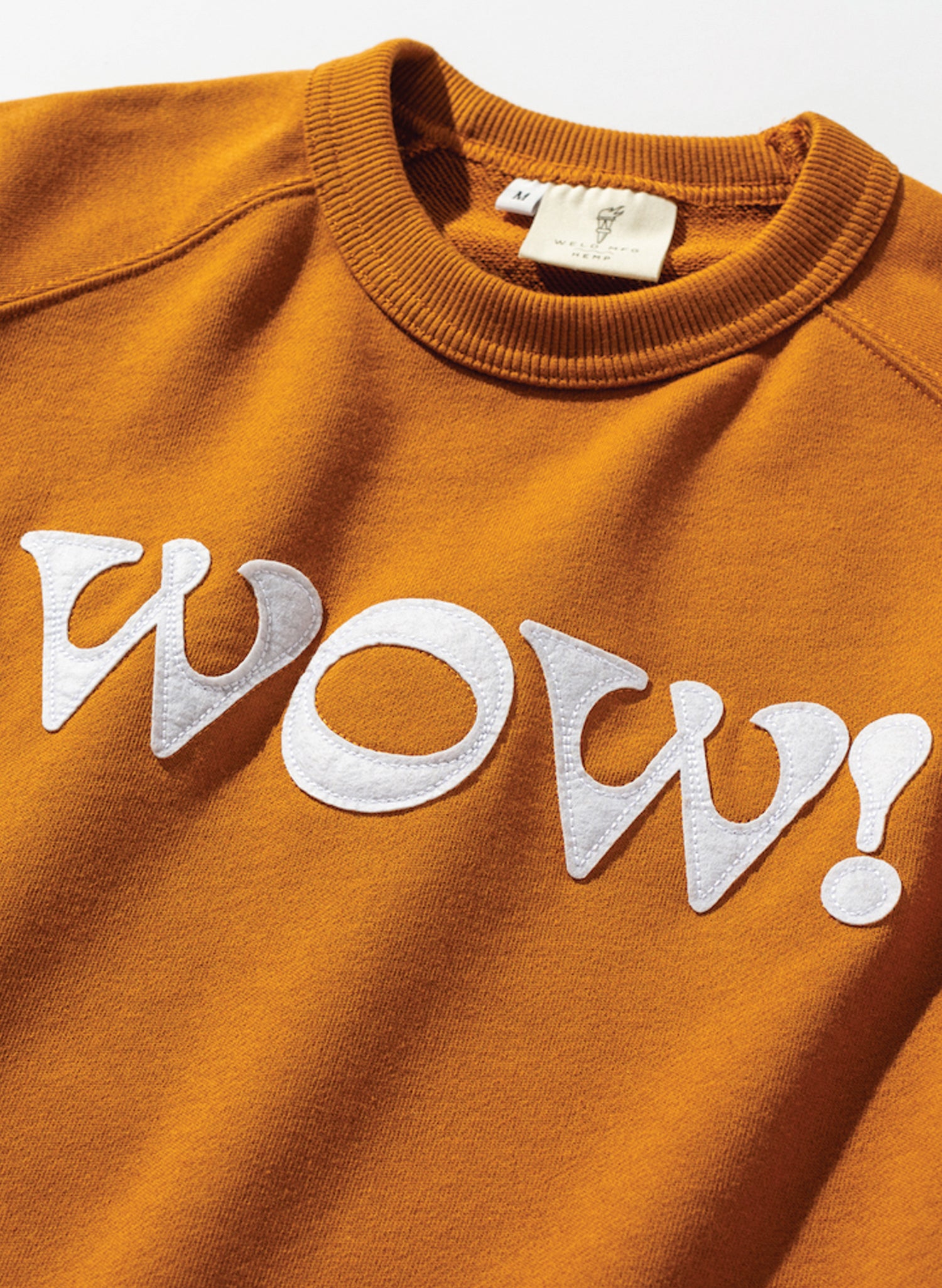 WELD MFG Custom Bespoke Rust Vintage Raglan Crewneck Sweatshirt in a Ramie + Cotton Blend, Made for Brands and Organizations featuring Felt Applique Letters sewn on the chest as decoration.