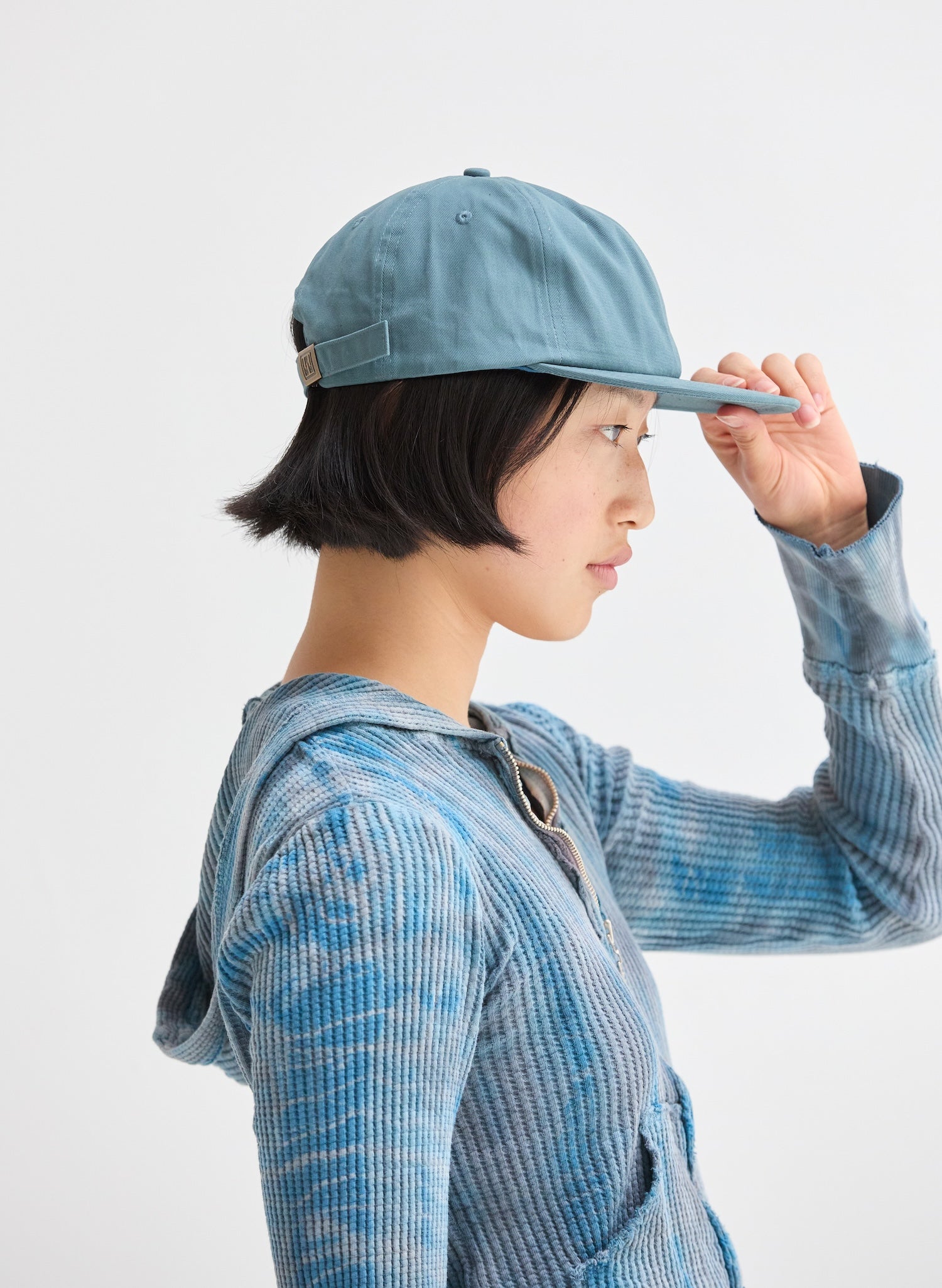 Female wearing a Heavy Seas Weld Mfg Brushed Cotton Twill 6 Panel Unstructured Field Trip Hat, Heavy Seas