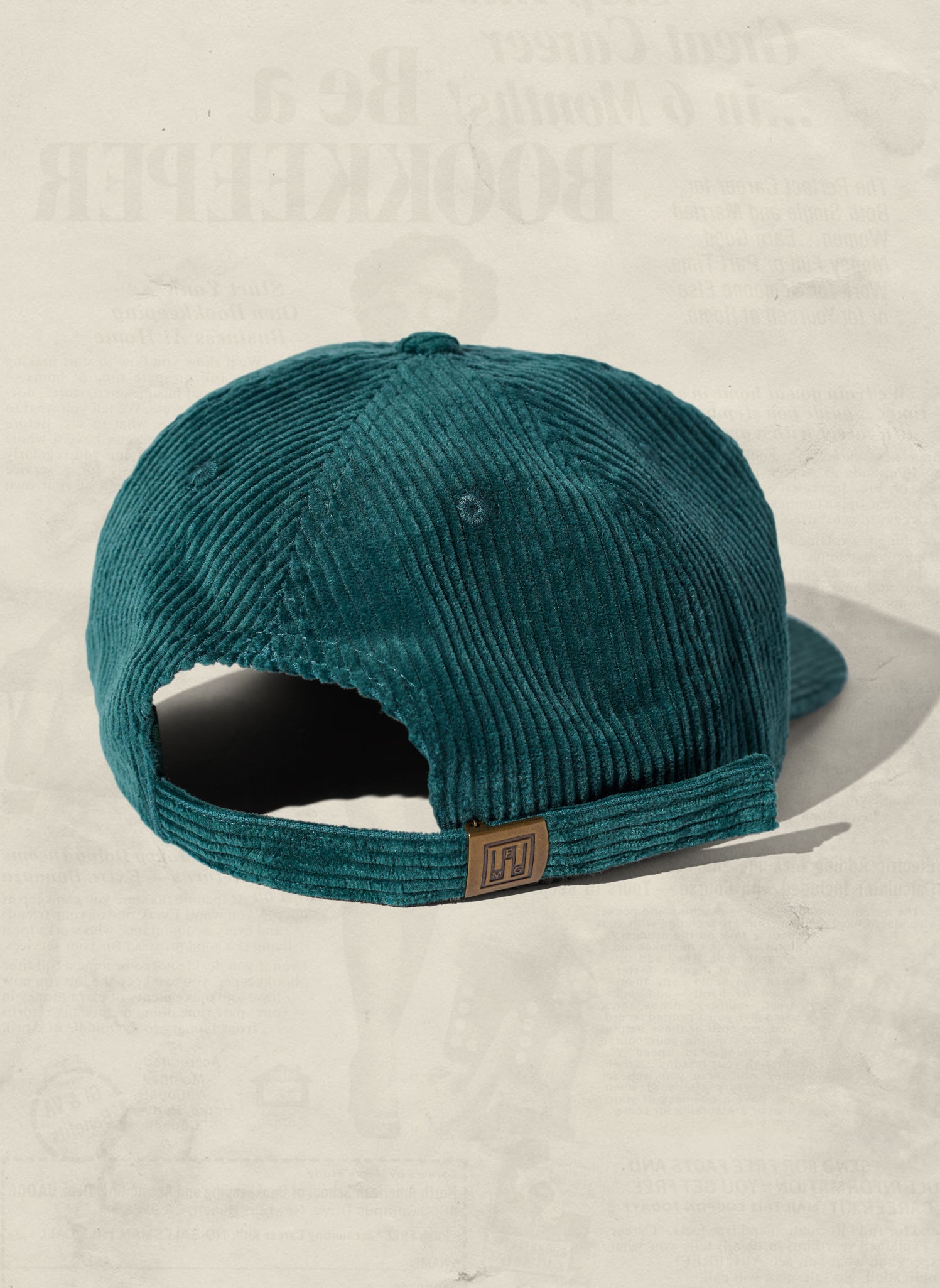 Rear view of the WELD MFG Corduroy Field Trip Hat featuring the brass buckle and fabric adjustment strap, Surf 